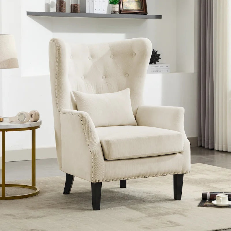 Fauteuil à oreilles en velours côtelé avec clous décoratifs, coussin lombaire et pieds en hévéa