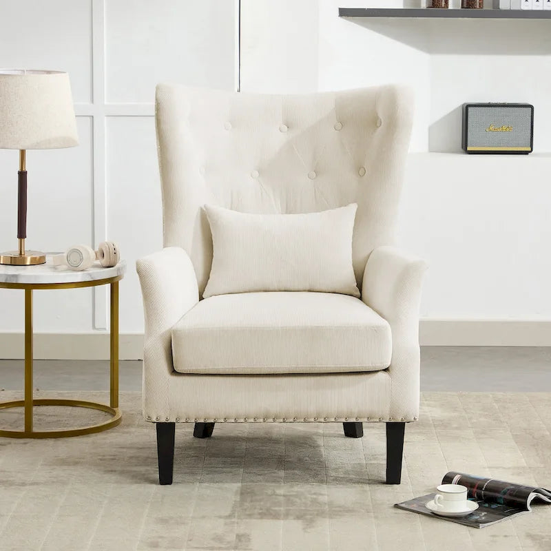 Fauteuil à oreilles en velours côtelé avec clous décoratifs, coussin lombaire et pieds en hévéa